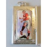 A silver stamp case with an enamel image of a vintage footballer