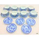 8 x blue and white Oriental teacups and 5 x blue and white side plates