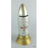 A WW1 British Red Cross Society collection tin in the form of a Bomb Shell 17cms high