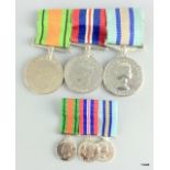 A WW2 mounted medal pair unnamed with an Elizabeth II Royal Observer Corps Medal named to Observer