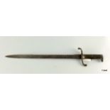 A Prussian model 1871 NCOs saw backed bayonet. 60cms overall length with pitting to the blade