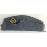 A WW2 Royal Air Force side cap with original badge and buttons with the original makers label: