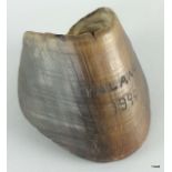 A Boer War trench art horse hoof which has been crudely engraved: Talana 1899