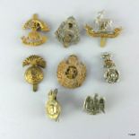 Eight assorted WW1 & WW2 military cap badges