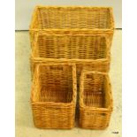 A set of four honey rattan storage baskets. largest 20 x 60 x 40cm
