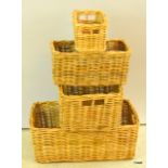 A set of four honey rattan storage baskets. largest 20 x 60 x 40cm