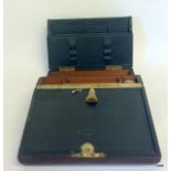 Mahogany writing slope with fitted interior, brass carry handle, inkwell & key