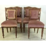 4 Art Nouveau carved dinning chairs on turned legs and covered seats.