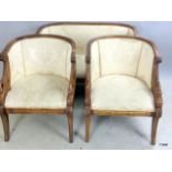 Three piece suite comprising of a two seater settee and two chairs with wood surrounds