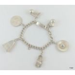 Silver charm bracelet and 6 charms