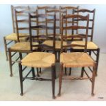 8 ladder back country chairs on turned legs and pad feet 4 bar back support and rattan seats 100 x