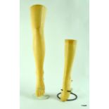 Two vintage shop display legs on stands for displaying stockings 79cms and 49cms tall