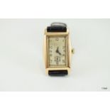 Deco Style tank watch wristwatch. 9ct gold tonneau. manual wind movement marked 15 jewels Swiss