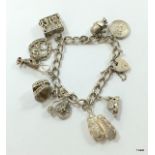 A silver charm bracelet with silver charms