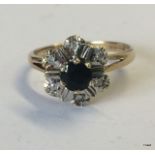 A ladies 9ct gold diamond sapphire cluster ring size n