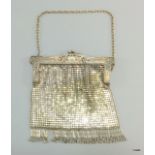 A ladies silver clutch bag 16 x 16cm