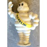 A waving Michelin man