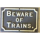 A beware of the train sign