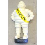 Michelin man standing on tyre