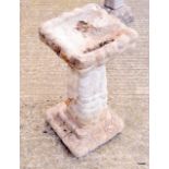 A reconstituted stone Bird Bath 25 inches high by 12 inches square at the top