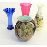 4 various vases to include cranberry and and early 3 handled vase