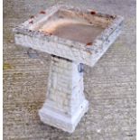 A reconstituted stone Bird Bath 25 inches high by 16 inches square at the top