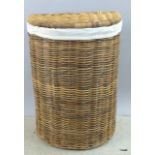 An extra large half moon honey laundry basket