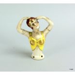 a ceramic art deco style pin dolly