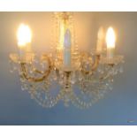 A glass crystal chandelier with 6 light fittings formally from The Queens Hotel ballroom