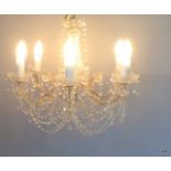 A glass crystal chandelier with 6 light fittings formally from The Queens Hotel ballroom