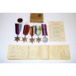 A WW2 Merchant Navy medal group of five including the Atlantic Star, his ID tag, medal paperwork,