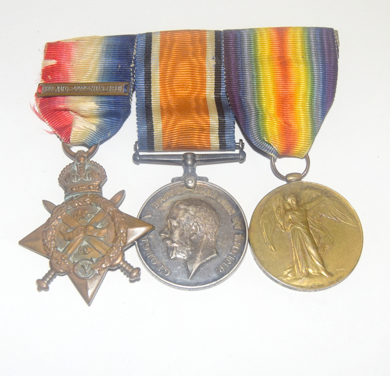 A mounted WW1 Mons Star with clasp medal trio named to T-21857 Driver W Thurston of the Army Service