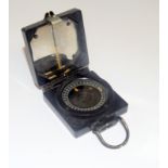 A WW2 Mark.1 magnetic Marching Compass with War Department arrow. Made by T.G. & Co. Ltd.