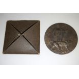 A WW1 Memorial Plaque or Death Penny in its original cardboard wallet awarded to William Jameson