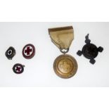 A WW1 Red Cross Society War Service Medal with a St John Ambulance medal and three Red Cross