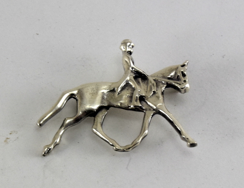 Silver brooch in the shape of horse and rider marked 925