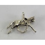 Silver brooch in the shape of horse and rider marked 925