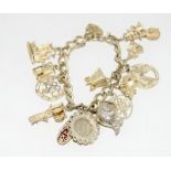 Silver charm bracelet and 14 charms