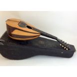 An antique Mandolin in case