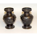 Pair oriental bronze vases with marks to the base 13cm tall