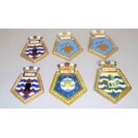 Six hand painted plaster Royal Navy ships crests, 2 x Bramble leaf, 2 x Fort Austin, Olna and Olwen.