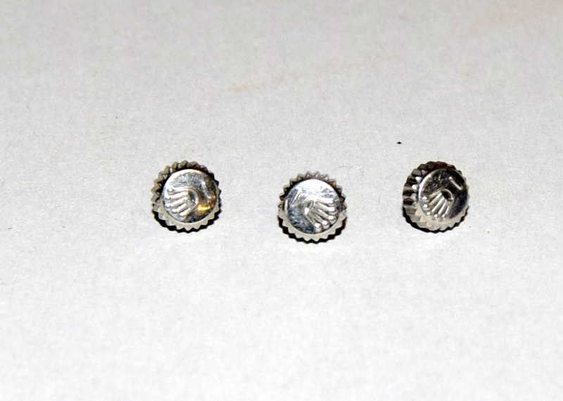 Three spare Rolex crowns