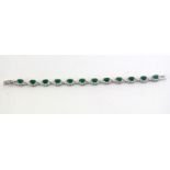 Pretty silver Cz and faux emerald bracelet in the daisy style