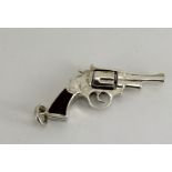 Silver revolver with an unusual wooden handle