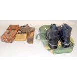 A green Army holdall containing a pair of size 8 Ammunition Boots, a 1939 Field Dressing, a Swiss