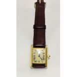 Ladies silver Cartier watch on a leather strap