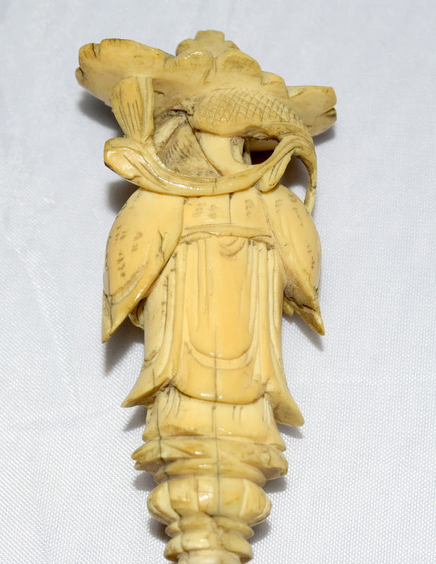 Ivory carved figure of a Chinese man standing on pine nuts - Image 6 of 7