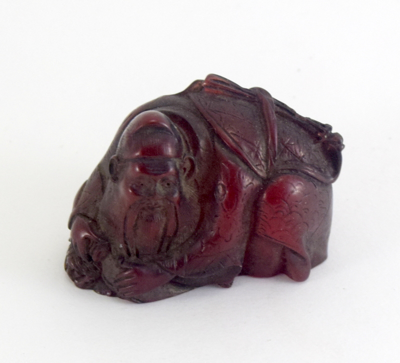 Seated buddha netsuke signed to the base