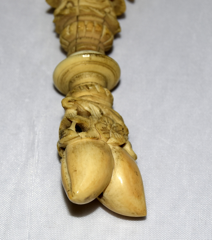 Ivory carved figure of a Chinese man standing on pine nuts - Image 2 of 7