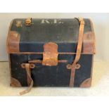 Leather bound travelling trunk with dome top and support straps ,internal fitment with removable